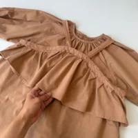 قیمت سارافون بچه‌گانه کتان قهوه‌ای مناسب مهمانی و استفاده روزمره