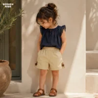استایل شیک و راحت کودک با شلوارک دخترانه بیرونی رنگ کرم و کمر کشی