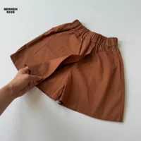 شلوارک کتان کاغذی قهوه‌ای دخترانه دارای کمر کشی و جیب کاربردی